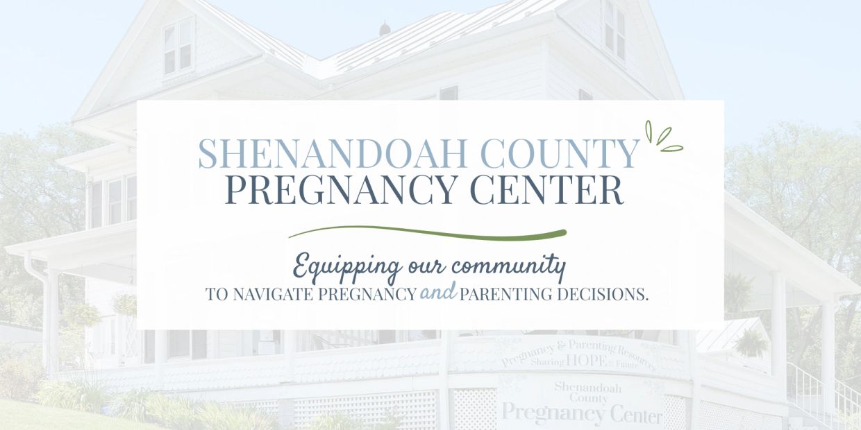 Sign for Shenandoah County Pregnancy Center with message about community support.