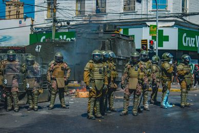 (Photo: Francisco Marin. Valparaiso, Chile. Riot troops standing on streets of city. 2019-2026.