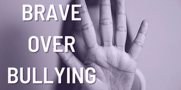 A hand raised with the words "BRAVE OVER BULLYING" promoting courage against bullying.