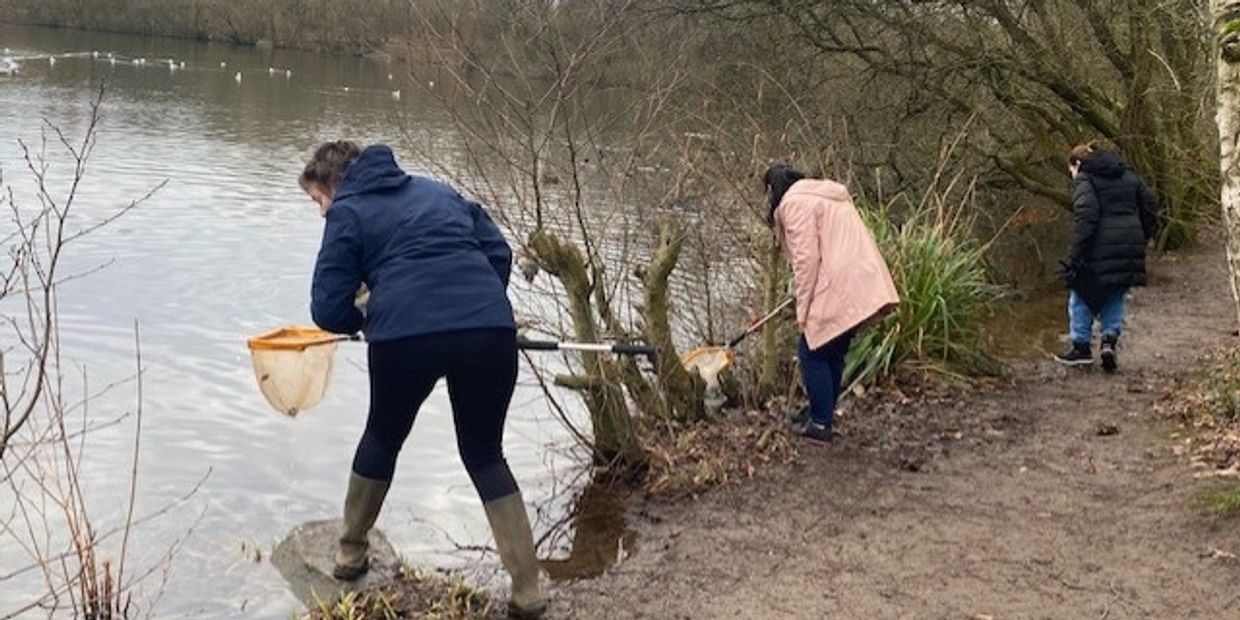 BMCA Ltd Walk and talk group enjoying a pond dipping activity at Chorlton Water Park