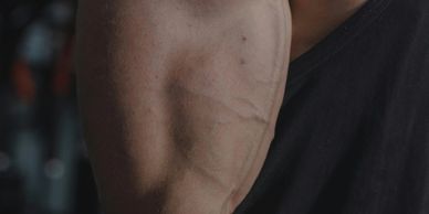 Close-up of a muscular arm with visible veins.