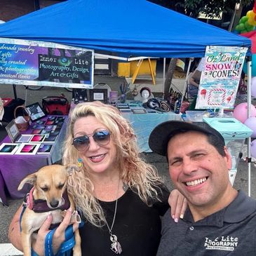 A couple Hold the dog See on the camera