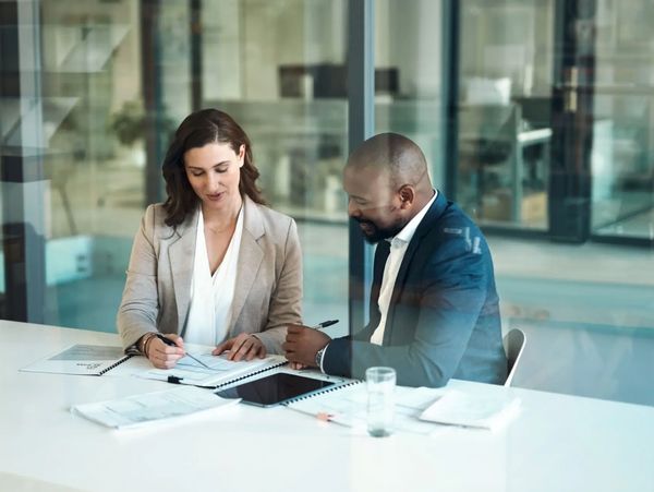 Professionals working at an office desk