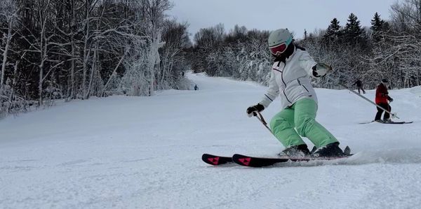 A person skiing on a snowy slope.