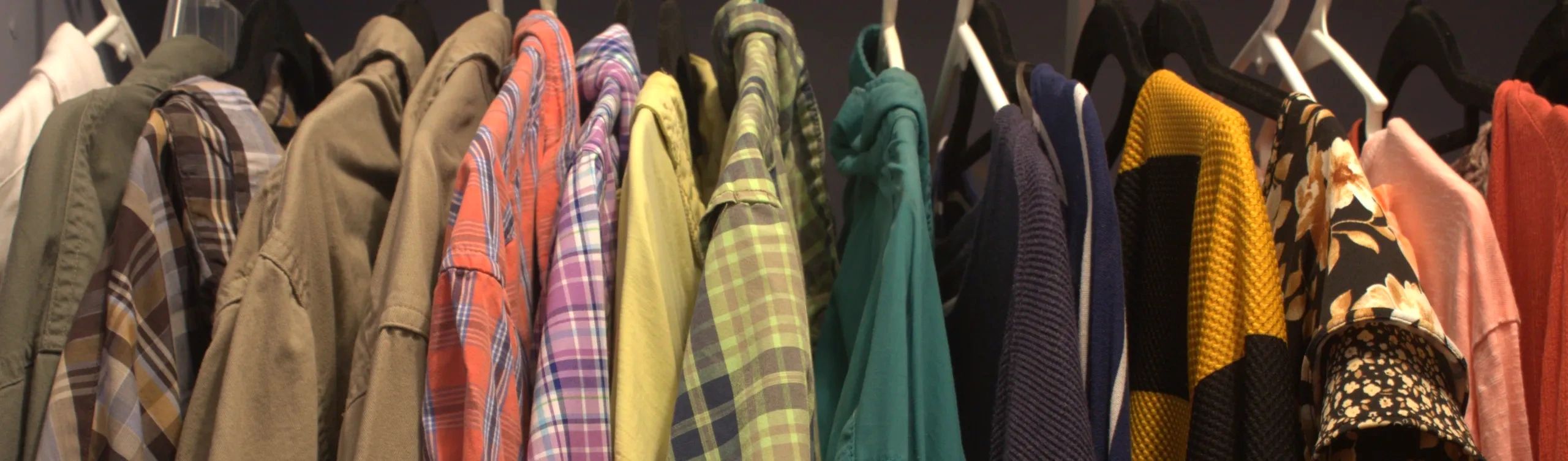 A rack of colorful clothing