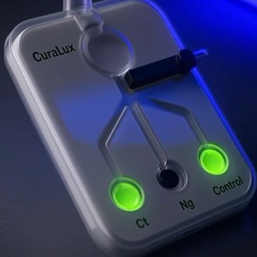 Close-up of a CuraLux medical device with glowing green indicators.