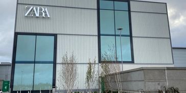 Modern Zara store facade with large glass windows and logo.