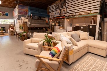 Cozy furniture showroom with beige sofas and chairs.