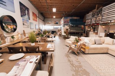 Spacious furniture showroom with modern and cozy decor.