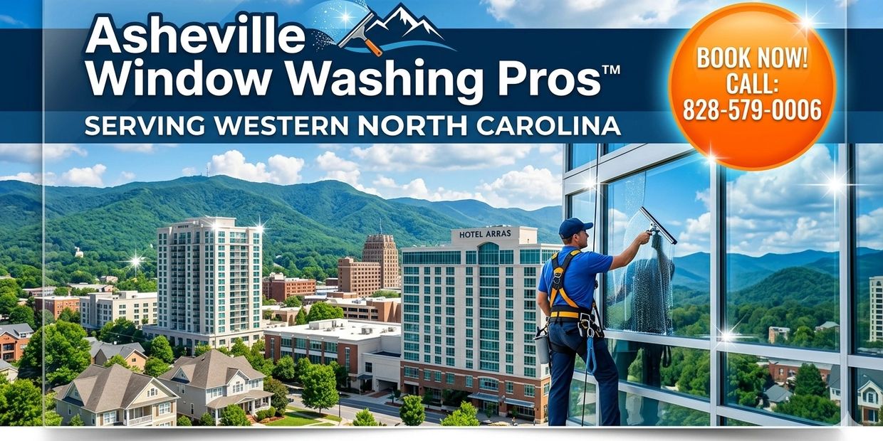 Professional window washer cleaning high-rise windows in Asheville, NC.
