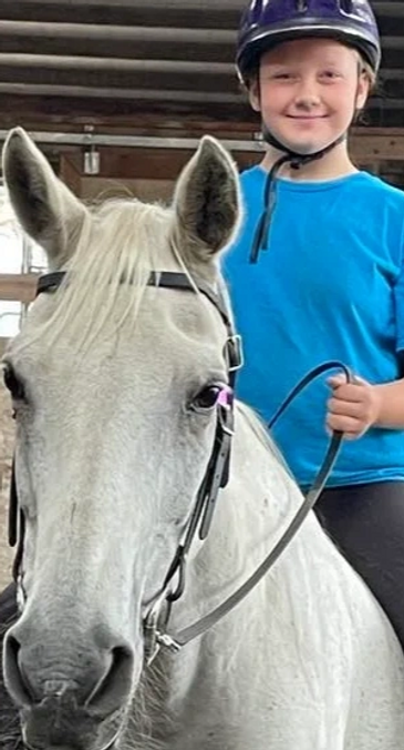 Elouise taking a bareback lesson on Arabian horse, Bianca.  