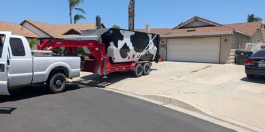 Marge the 21 yard dumpster getting picked up after trash grazing!