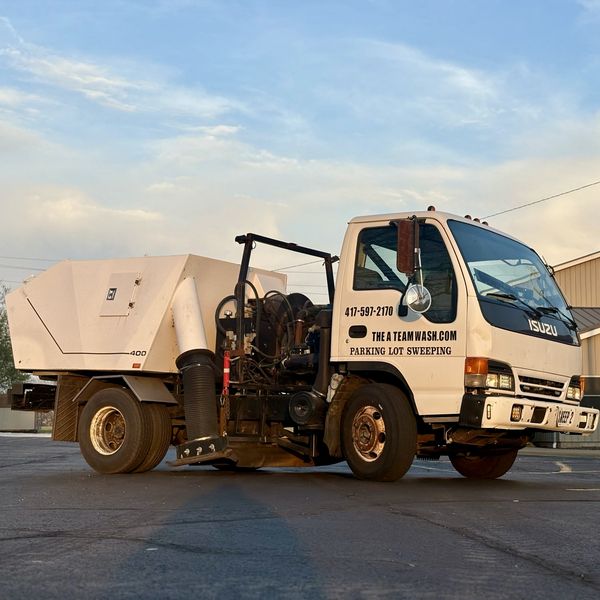 Sweeper truck cleaning parking lot in Ozark Missouri