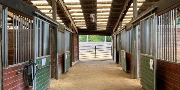 Comfortable, Safe, and Thoughtfully Designed Stabling

Our barn features spacious, well-ventilated s