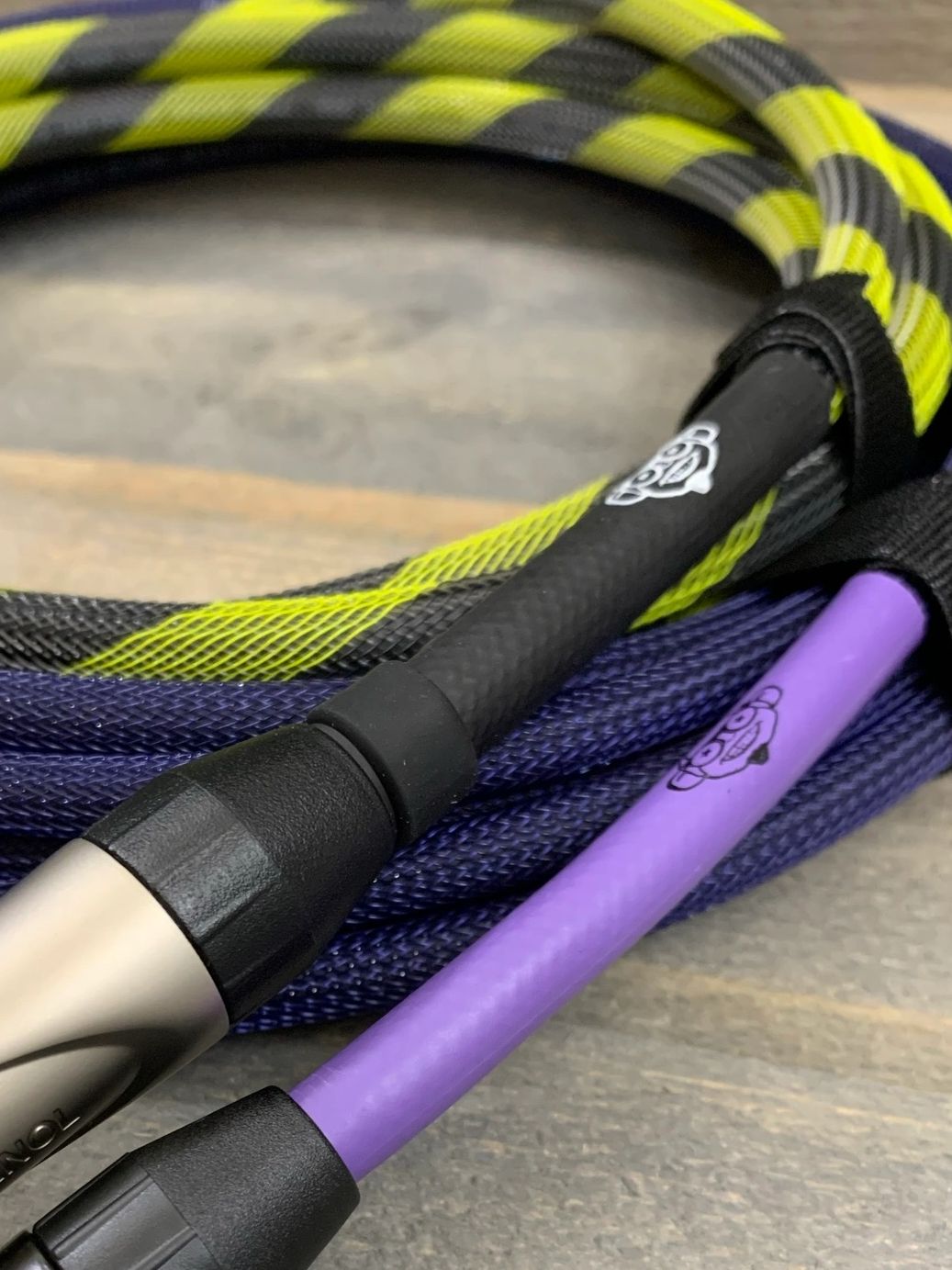 Shown here is a Monkey Wires speaker cable wrapped in Safety Stripe (Yellow/Black) colored Cable Arm