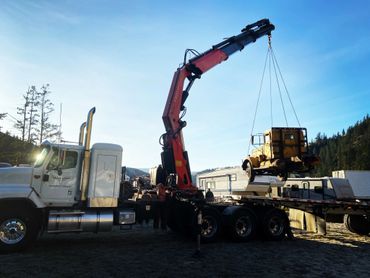 Crane Lifting Old Truck
