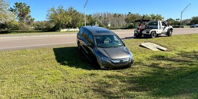 TP Towing assisting driver on Wesley Chapel backroad
