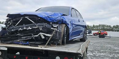 Damaged car removed from accident scene by TP Towing