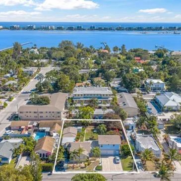 Aerial view of a residential neighborhood near a large body of water.