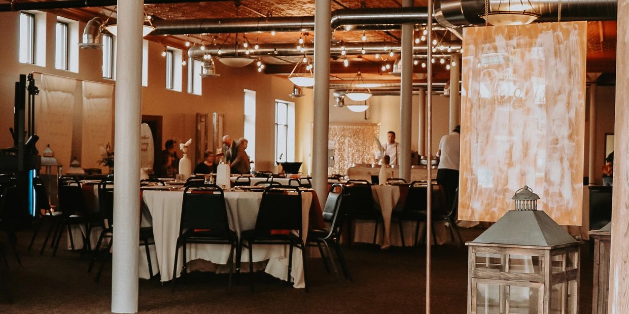 Industrial looking large room decorated for a wedding