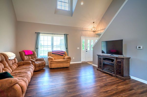 Great room with luxury vinyl plank flooring new home built by Lavish Builders Eaton Rapids Michigan.