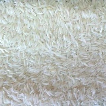 Close-up image showing a large quantity of uncooked white rice grains.