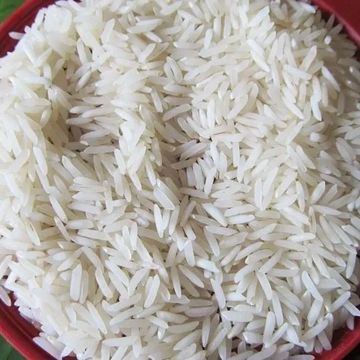 Close-up of uncooked white rice grains in a red container.