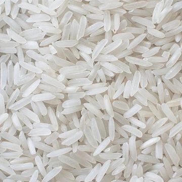 Close-up of uncooked white rice grains densely packed.