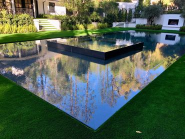 Perimeter edge design swimming pool with infinity edge spa.