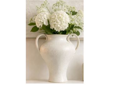 White flowers in an elegant white vase.