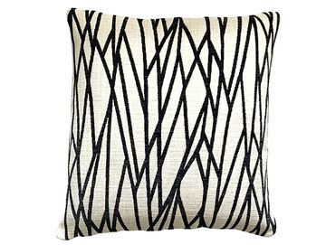 Black and white geometric patterned pillow.