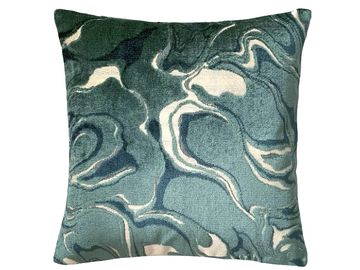 Decorative pillow with blue and white abstract pattern.