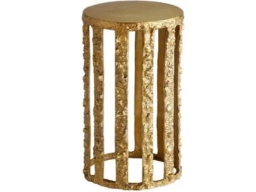 Decorative gold cylindrical stool with textured vertical bars.