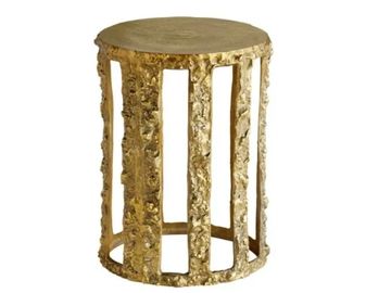 Round gold textured side table with open vertical slats.