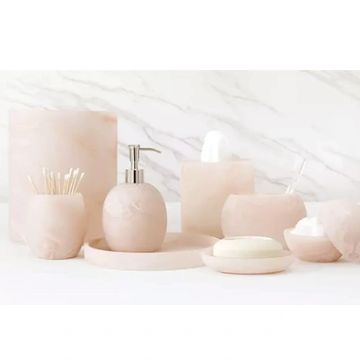 Elegant pink marble bathroom accessories set.