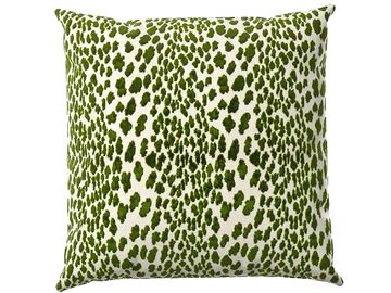 Square pillow with green leopard spots.