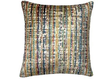 Square pillow with a colorful striped pattern.