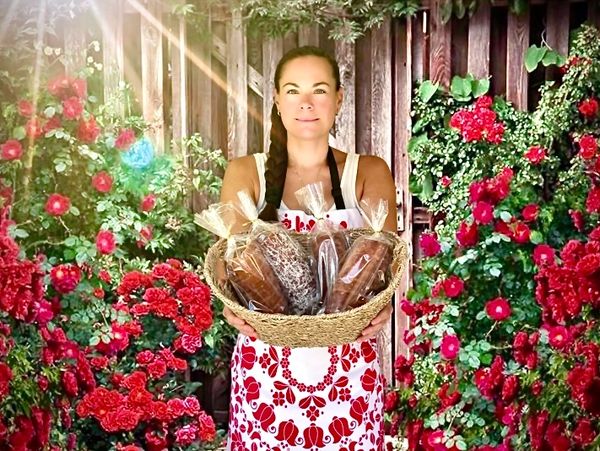 Baked goods are offered in a beautiful country side from a branding photo session.