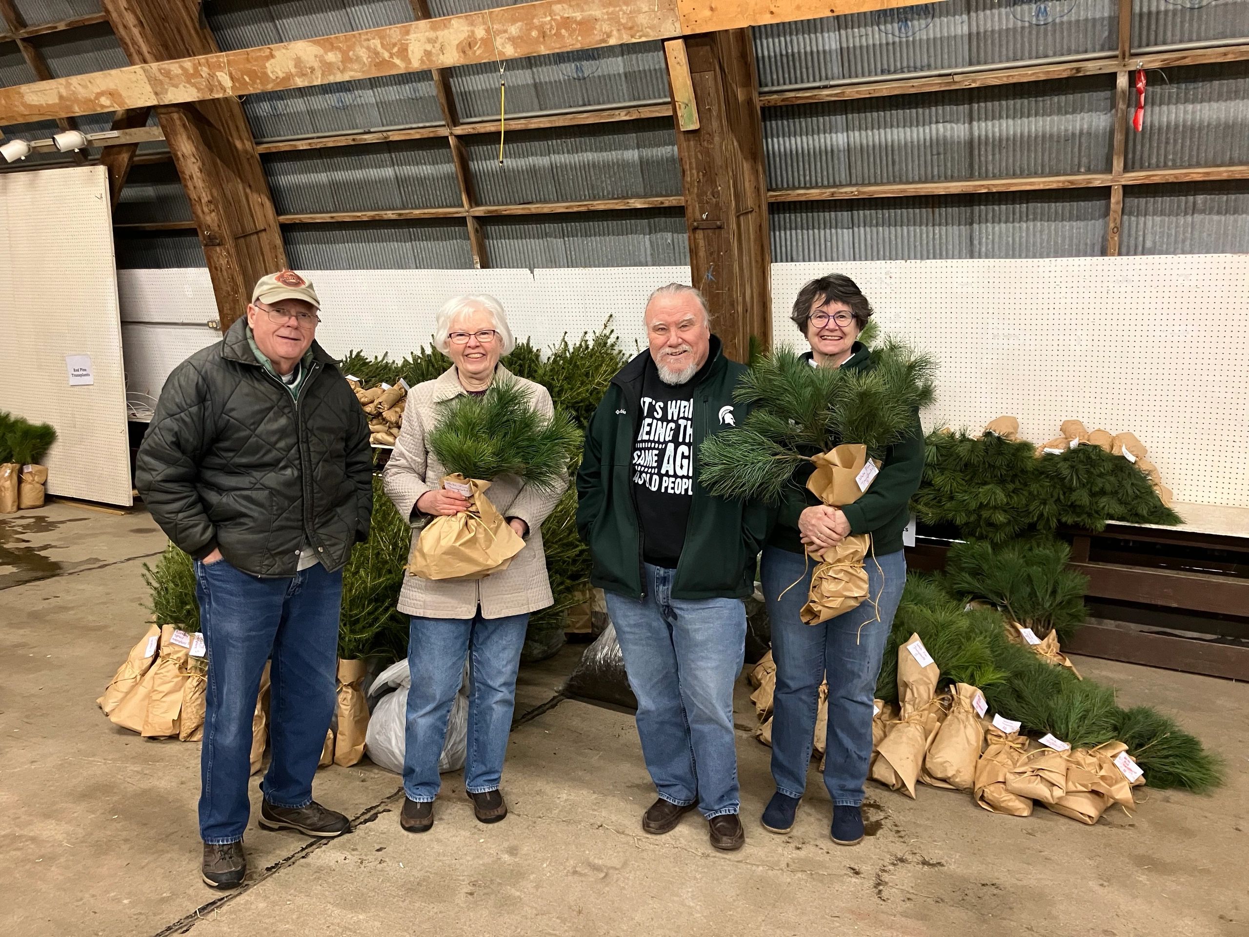 Loyal Clinton County Dems Ron & Johanna Balzer and Lois & John Husby helped to wrap trees for Clinto