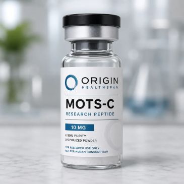 A vial of MOTS-C research peptide by Origin Healthspan on a marble surface.