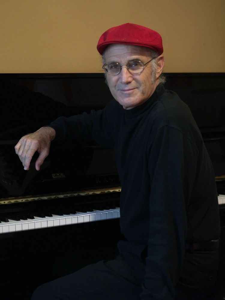 Steve Sternberg at home with his piano