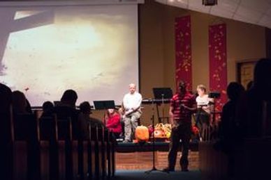 Changing Church Culture: People on stage leading worship in a church
