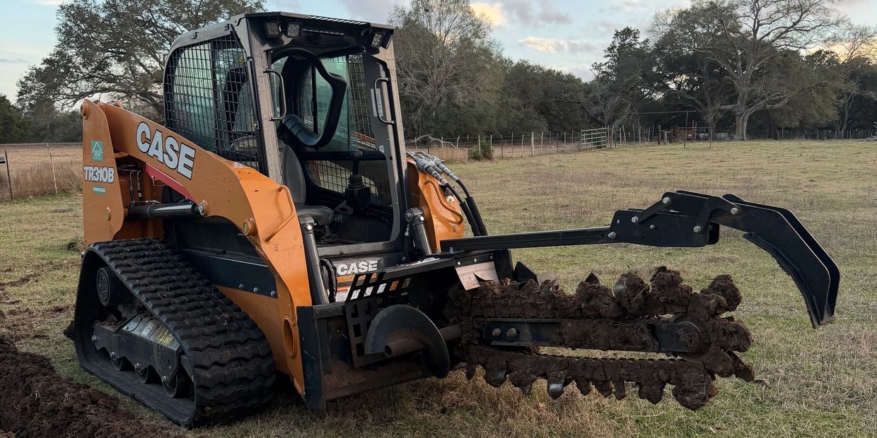 CASE TR30B trencher machine with digging chain and blade attachment on grassy field.