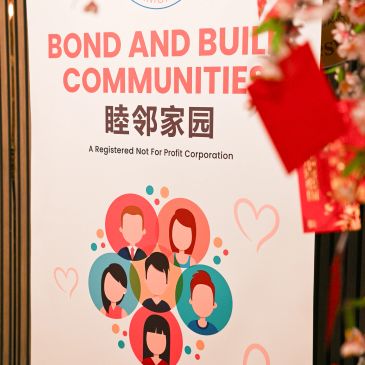 Sign promoting community bonding and building by a nonprofit organization.