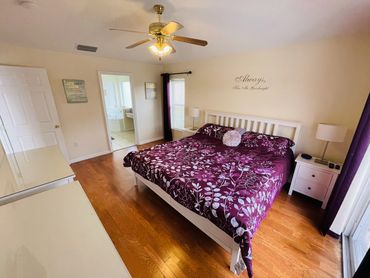 Master King Bedroom. AC / ceiling fan / LED TV. En-suite corner bath, walk-in shower, basin & WC.