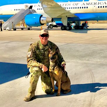 K9 Jango and handler Brock Mueller providing explosives detection for Air Force 2