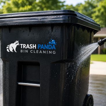 Trash Panda bin being cleaned with water spray.