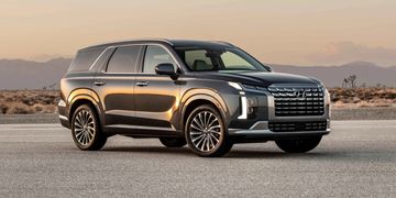 A black SUV car on the road