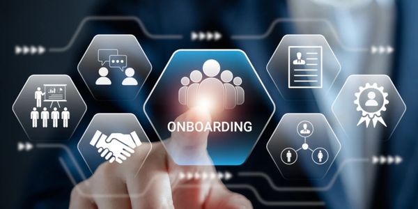 Person interacting with a digital onboarding interface in a business setting.