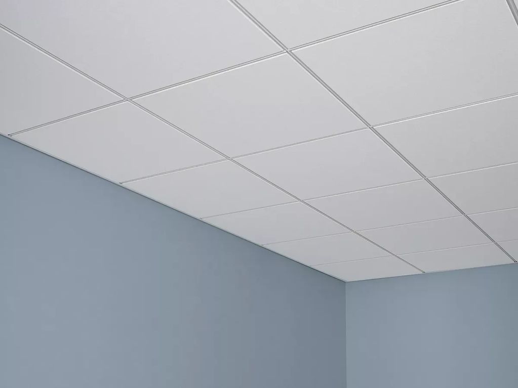 White drop ceiling with blue walls.